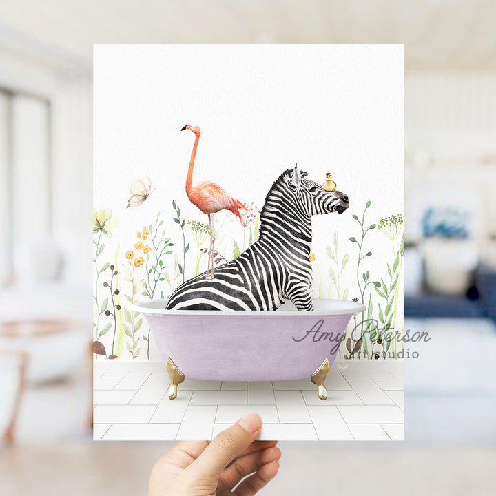 a hand holding a card with a zebra and a flamingo in a bathtub