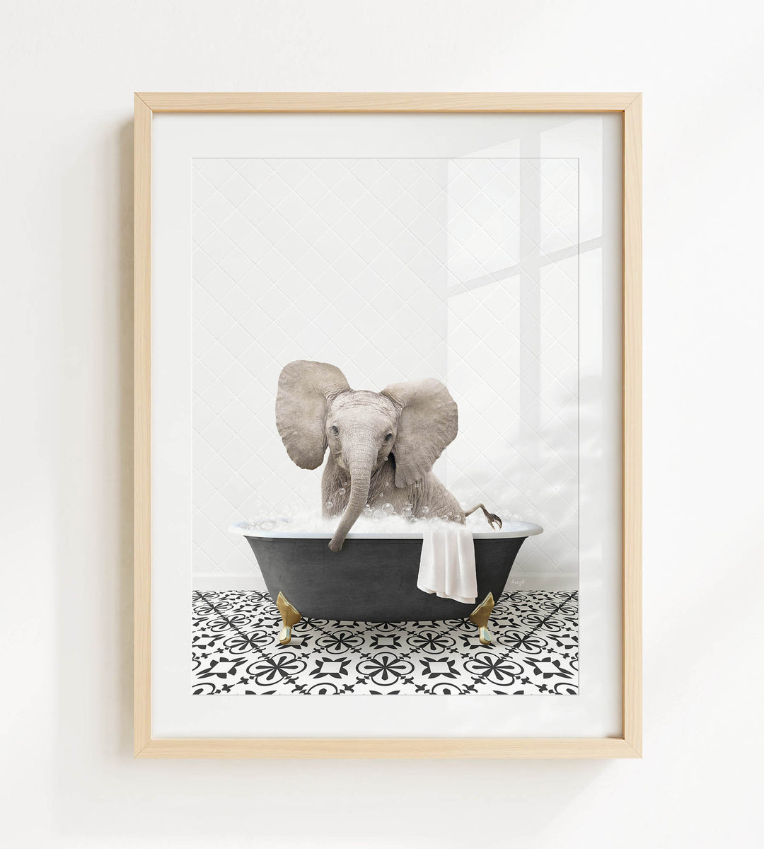 A framed image of an elephant sitting in a bathtub filled with water, surrounded by a black and white patterned floor.