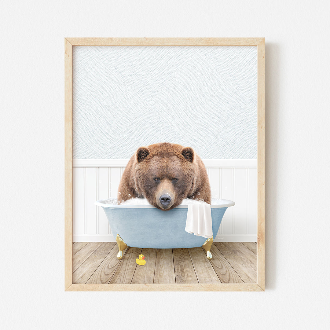 a brown bear sitting in a blue bath tub