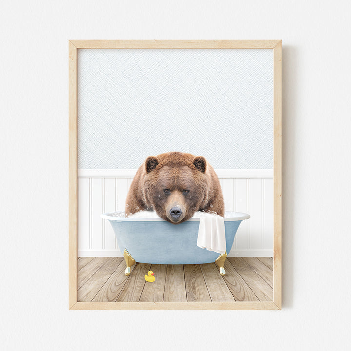 a brown bear sitting in a blue bath tub