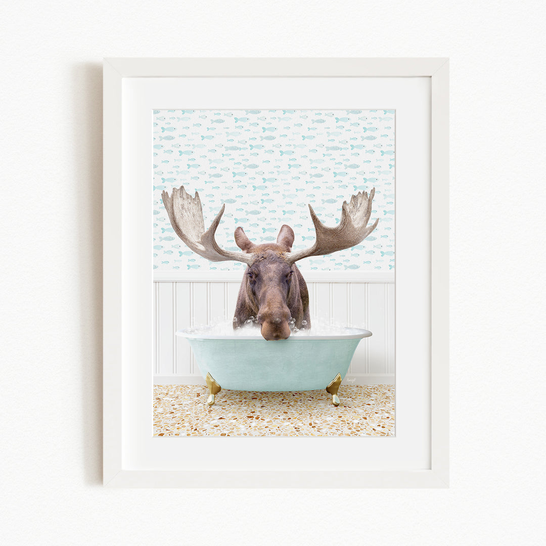 A moose with large antlers is sitting in a light blue bathtub, surrounded by a patterned wall and a beige floor.
