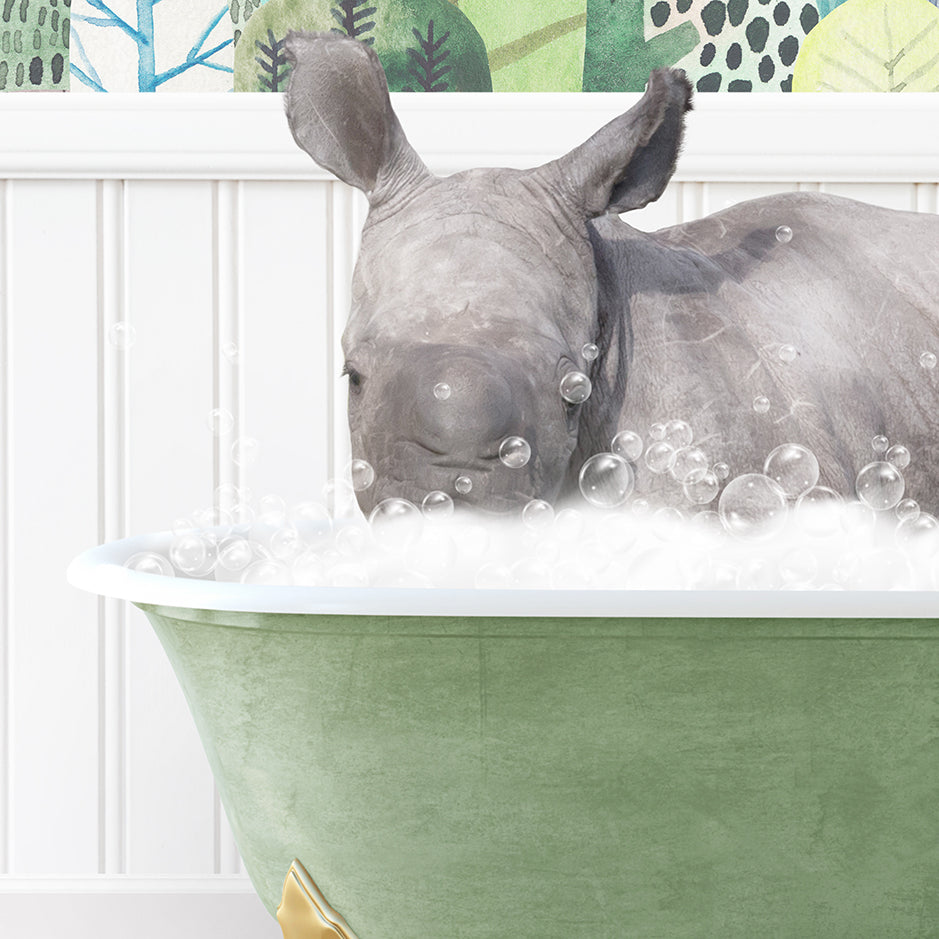 a rhino is taking a bath in a green tub