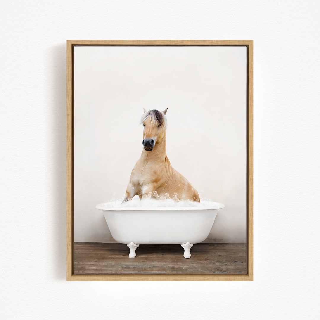 A light brown horse is sitting in a white bathtub filled with water, creating a serene and peaceful scene.