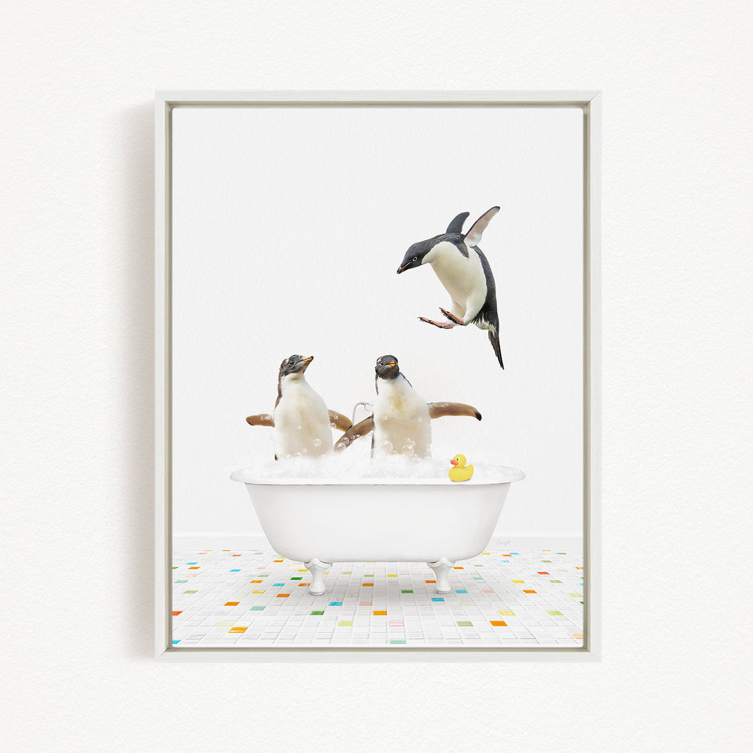 A framed image depicting two penguins sitting in a bathtub, with one penguin standing on its hind legs and another penguin sitting in the tub.