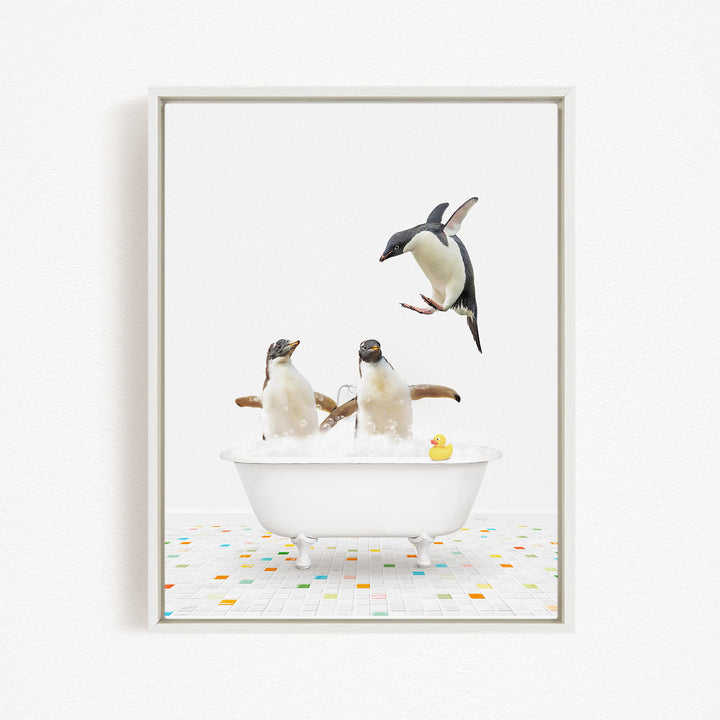 A framed image depicting two penguins sitting in a bathtub, with one penguin standing on its hind legs and another penguin sitting in the tub.