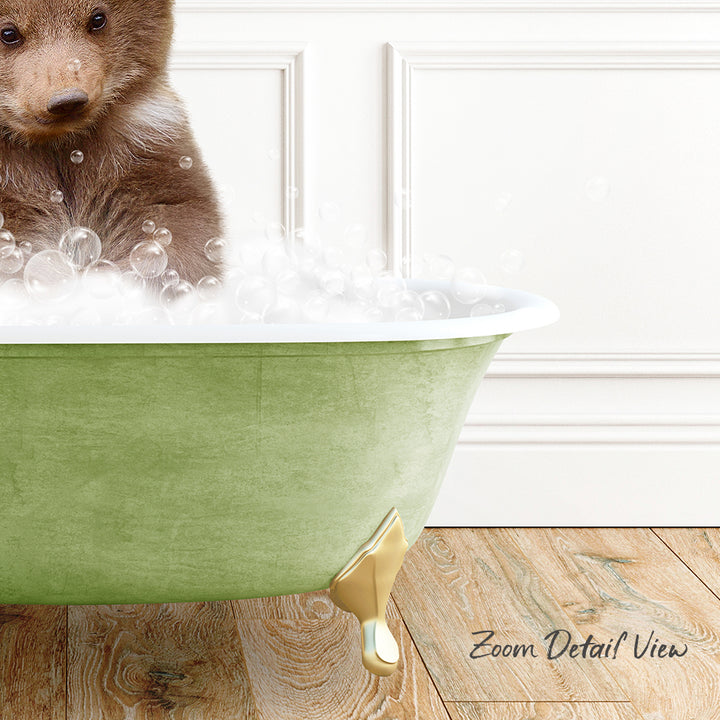 A cute brown bear sitting in a green bathtub filled with bubbles, with a wooden floor and white walls in the background.