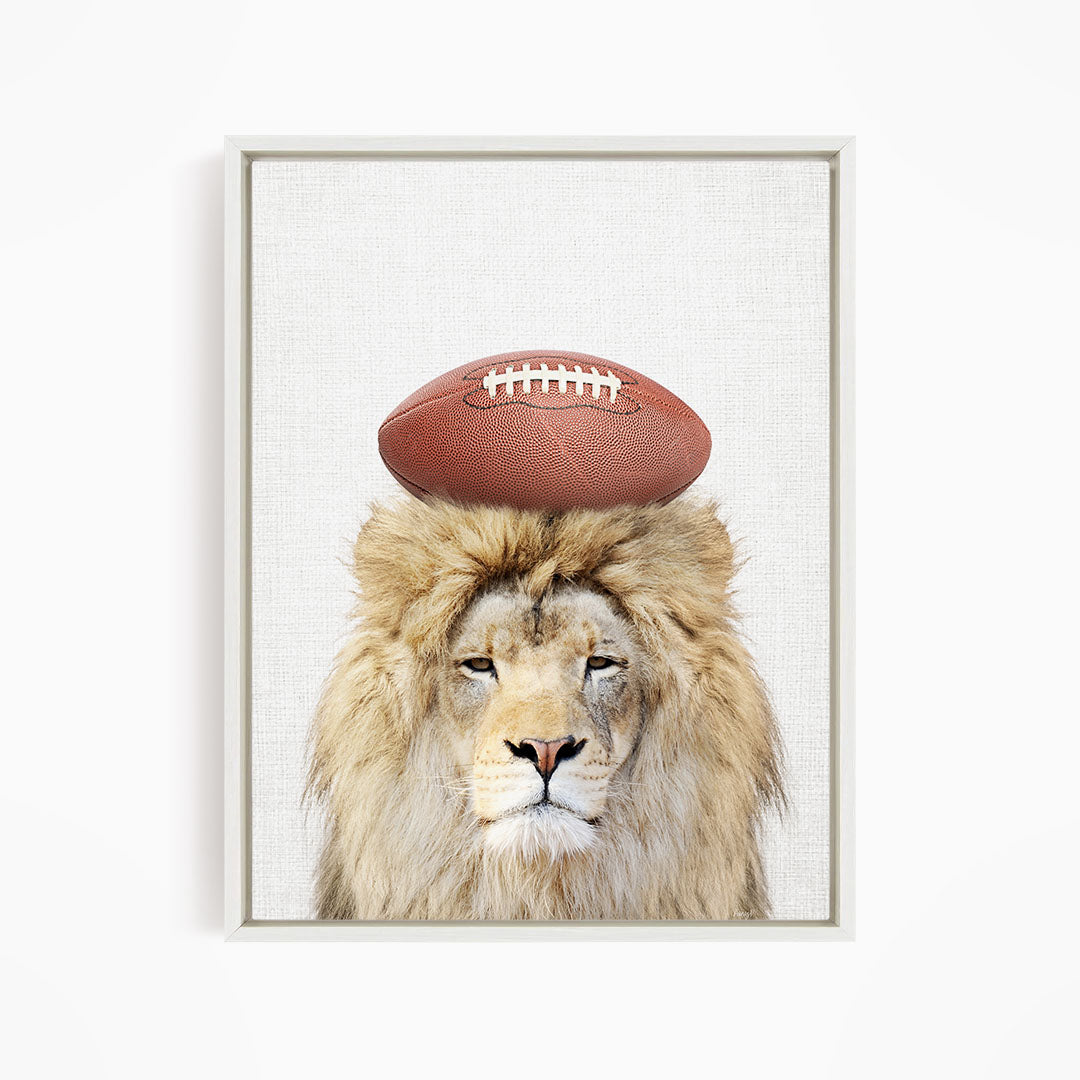 A lion with a football on its head.