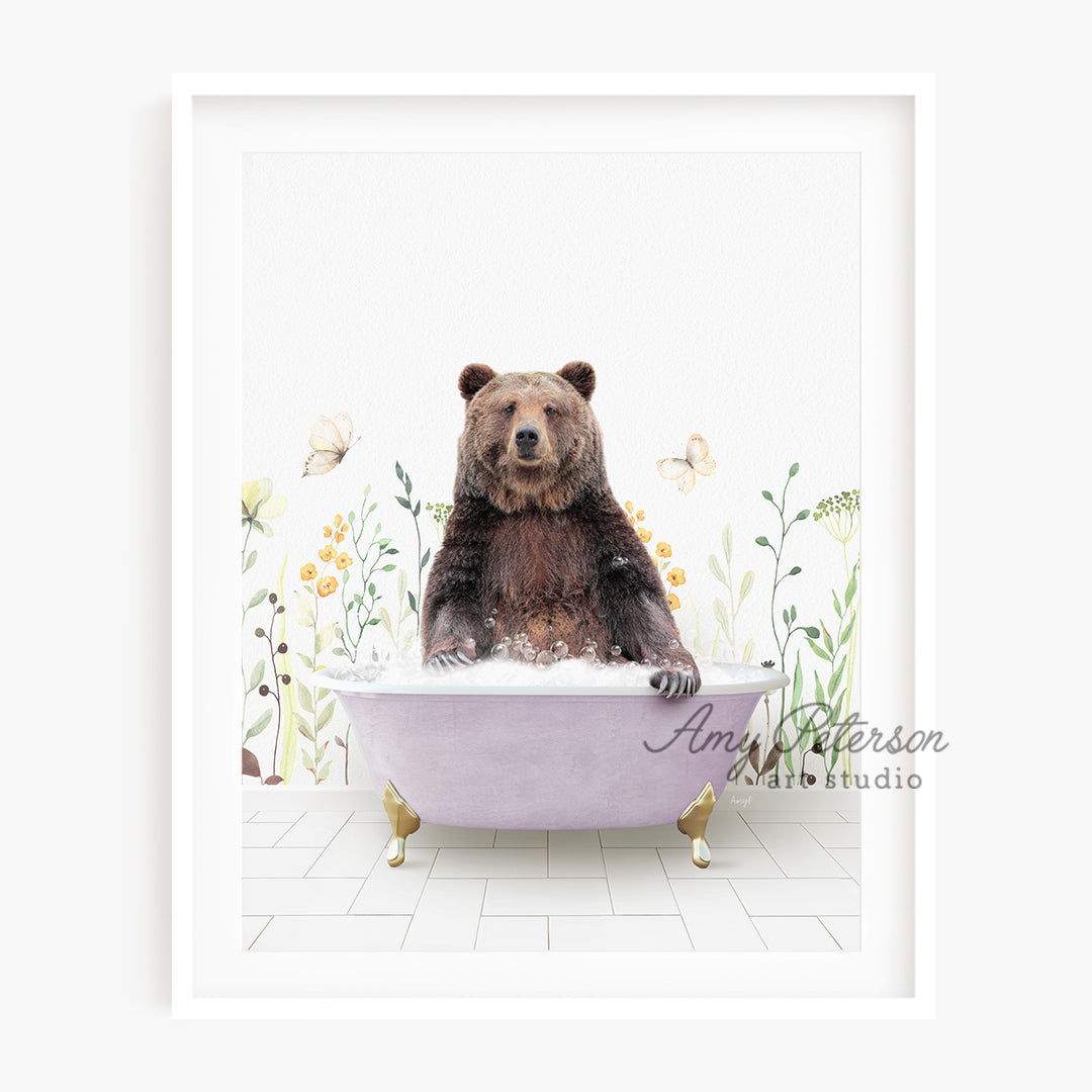 a bear sitting in a bathtub with flowers on the wall behind it