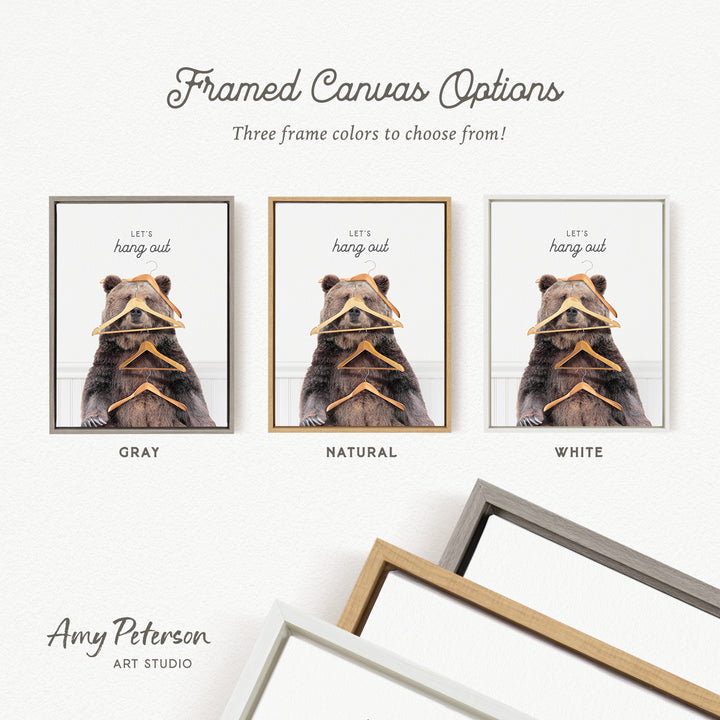 three framed canvas options, each featuring a bear holding a pair of clothes. The options include a gray frame, a natural frame, and a white frame. The text above the images reads "Let's hang out" and "Let's hang out" is written in a different color for each frame option.