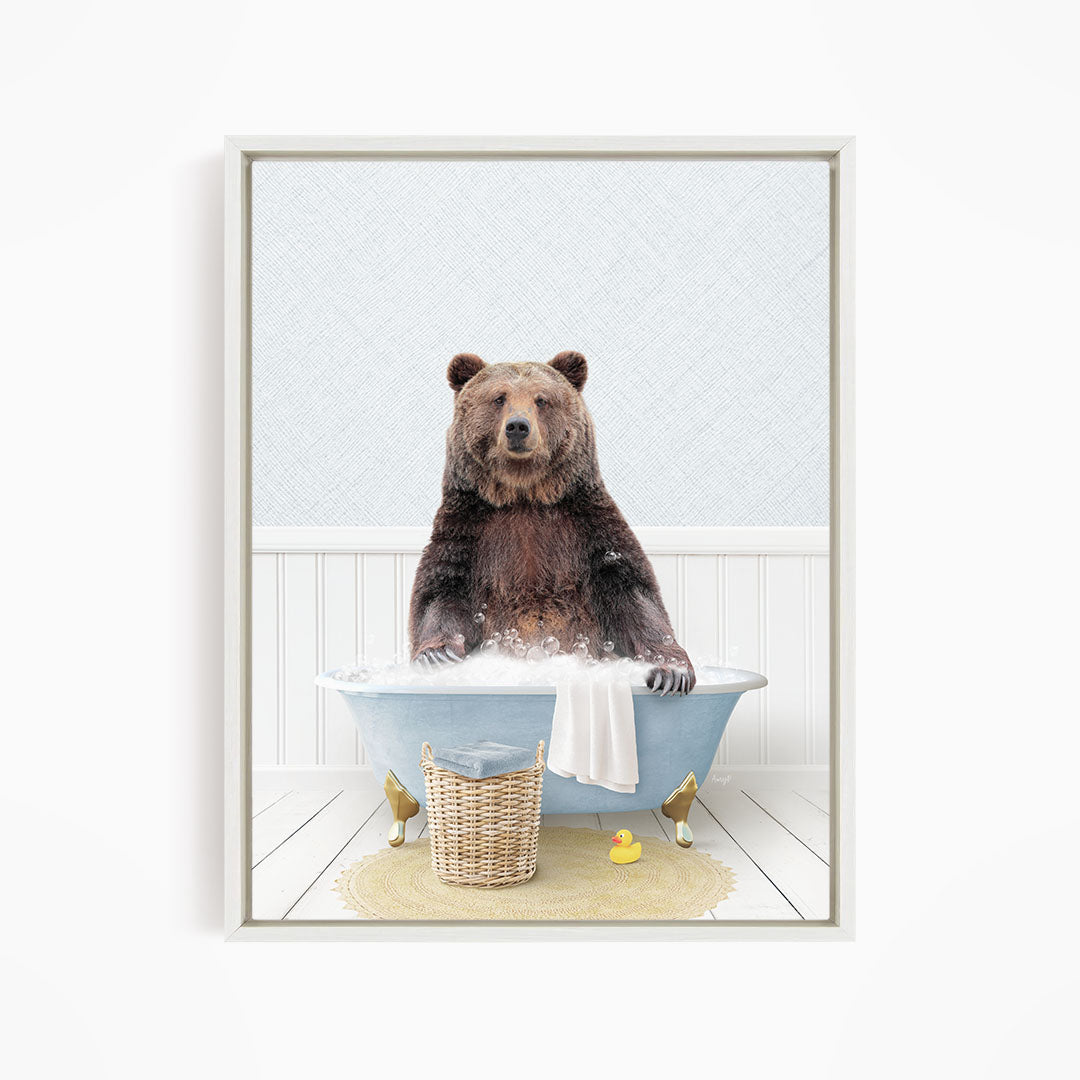 A brown bear sitting in a blue bathtub filled with water, surrounded by a yellow rubber duck and a wicker basket.