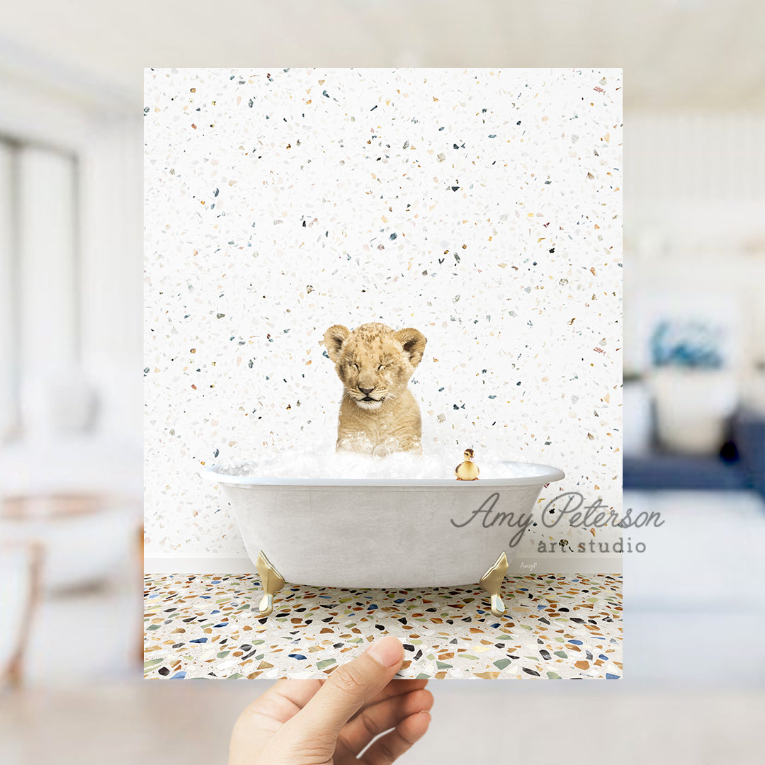 a hand holding up a card with a picture of a lion in a bathtub