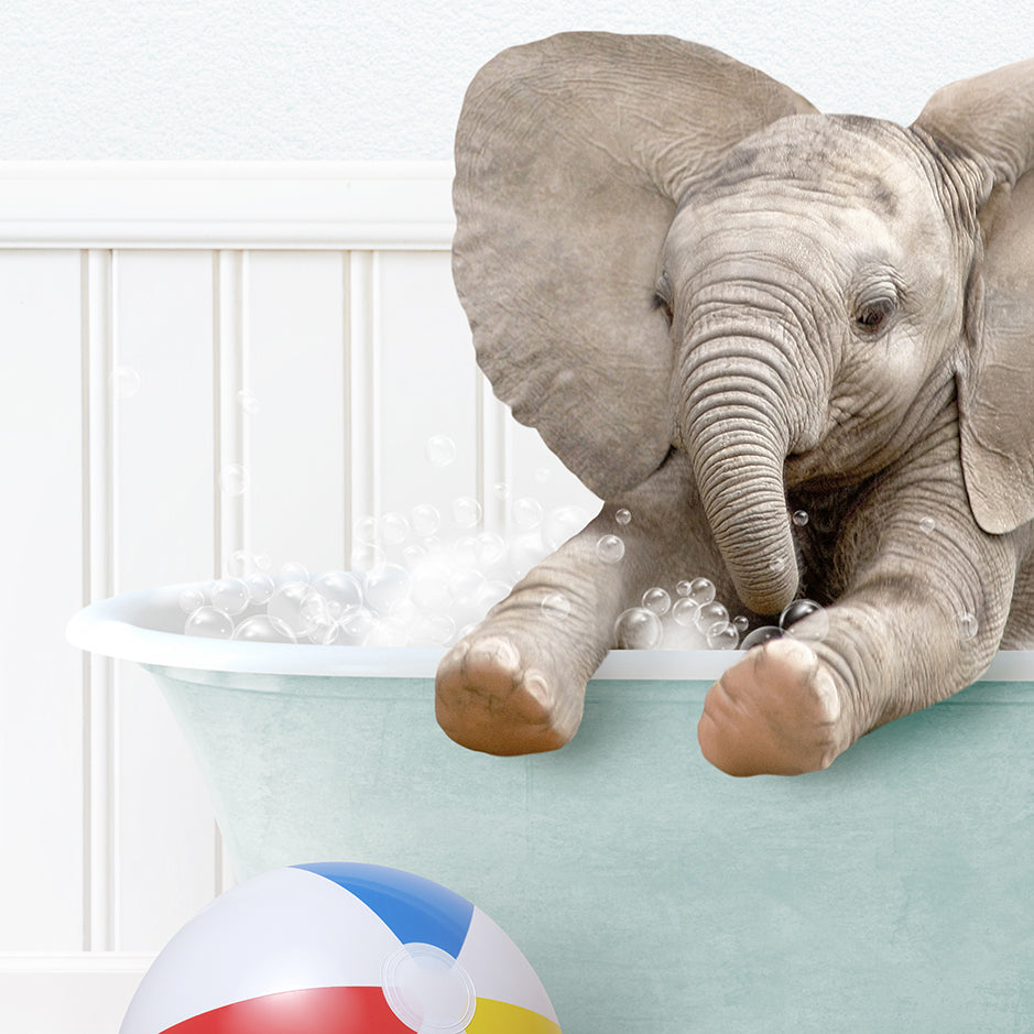 a baby elephant taking a bath in a bathtub