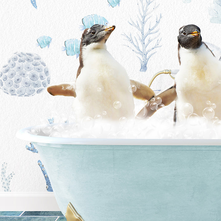 two penguins sitting in a bathtub with bubbles