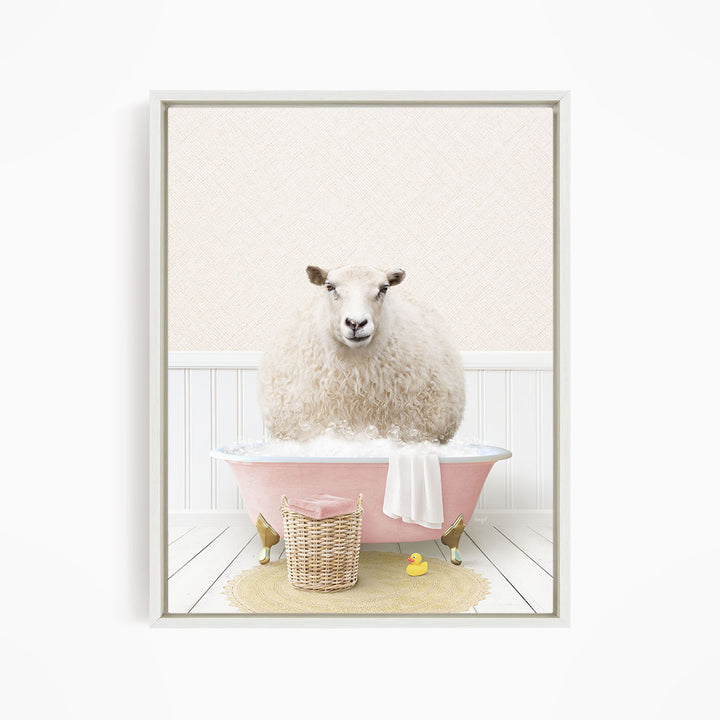 A fluffy white sheep sits in a pink bathtub filled with bubbles, surrounded by a yellow rubber duck and a wicker basket.