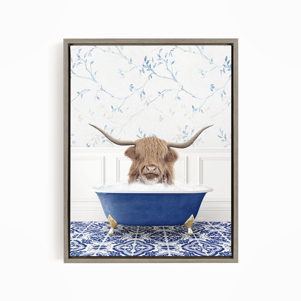 A brown cow with long horns is sitting in a blue bathtub filled with water, surrounded by a blue and white patterned floor.