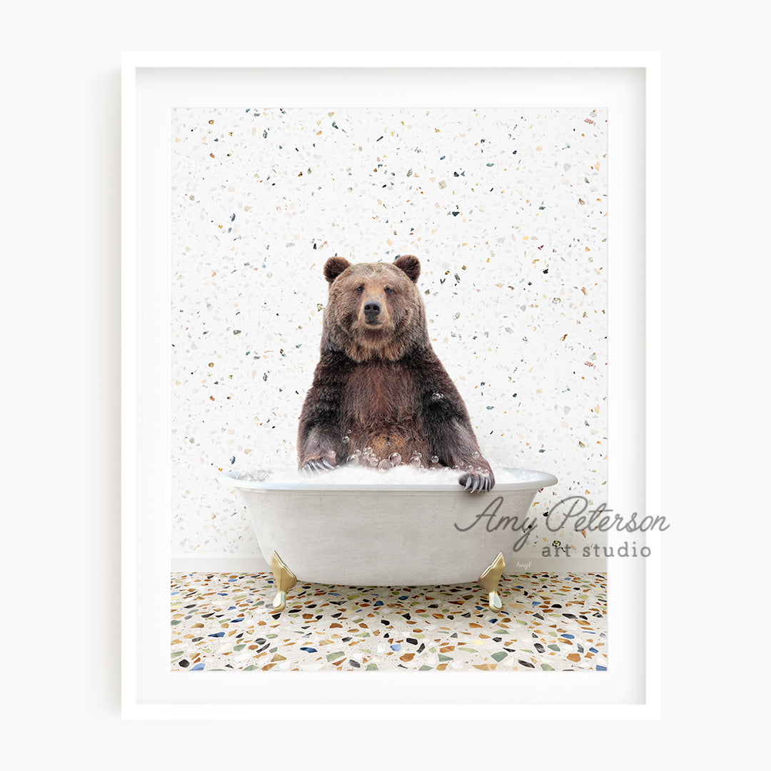 a brown bear is sitting in a bathtub