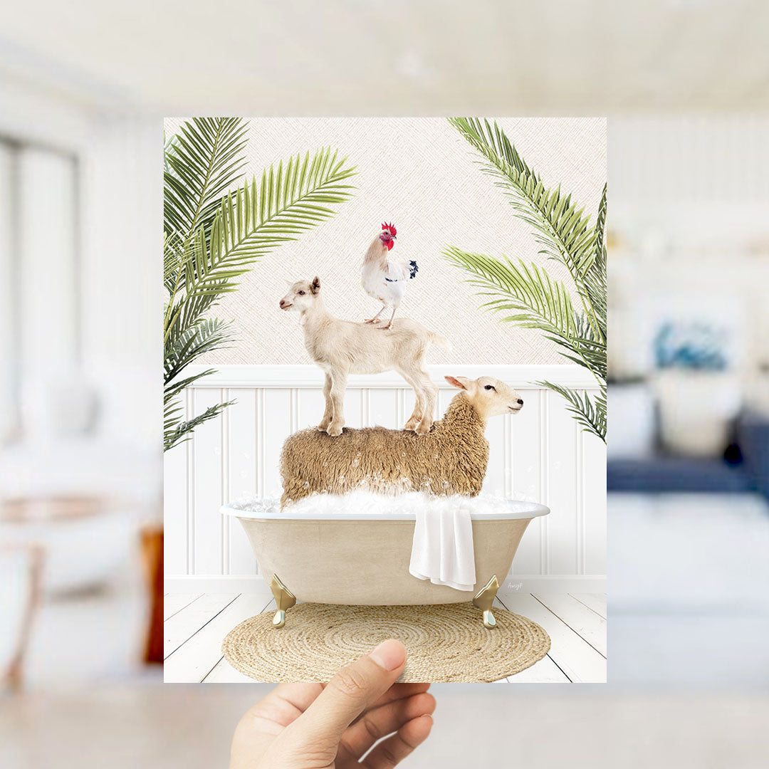 A hand holds up a framed image depicting a sheep standing on a tub filled with water, with a chicken perched on top of it.