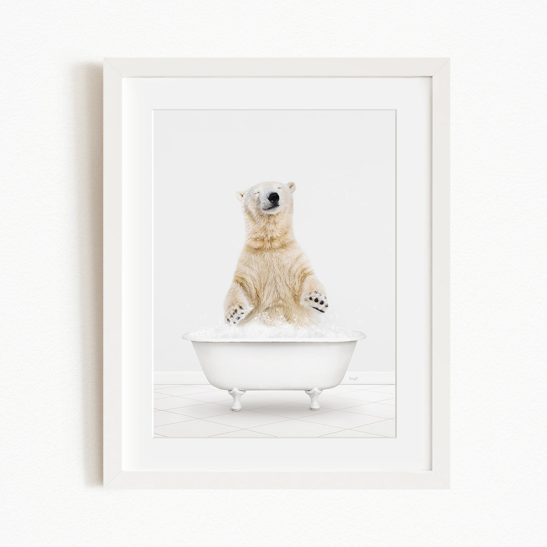 A polar bear standing in a white bathtub filled with water, appearing to be enjoying a bath.