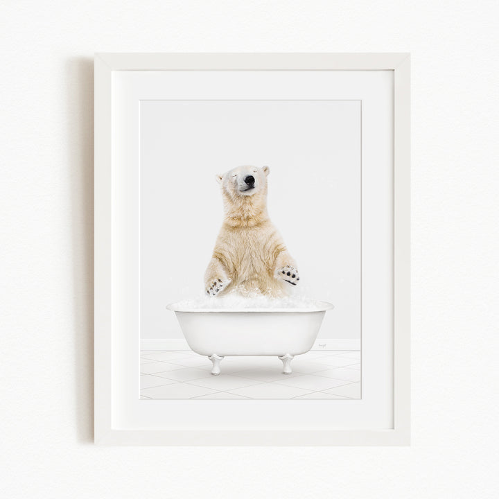 A polar bear standing in a white bathtub filled with water, appearing to be enjoying a bath.