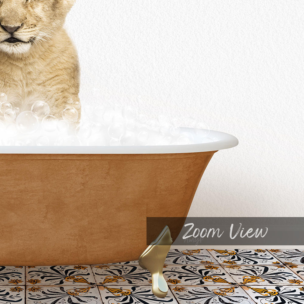 A golden bathtub filled with bubbles, with a cat sitting inside and looking at the camera.