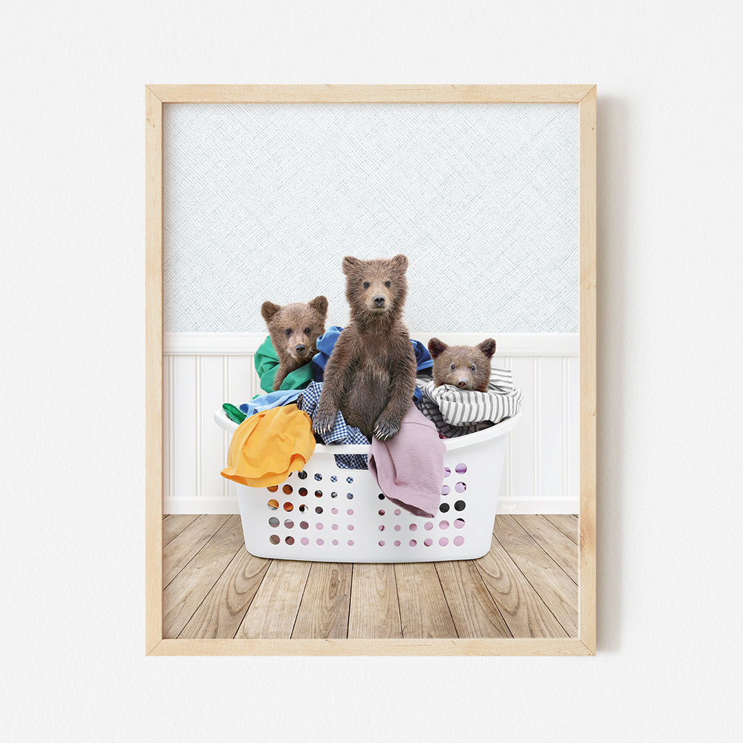 a group of bears sitting in a laundry basket