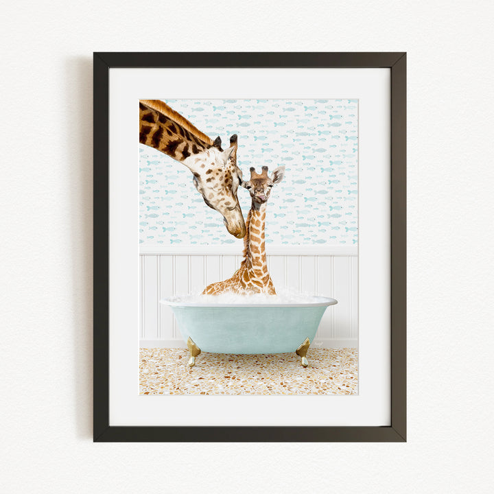 A giraffe and a baby giraffe are sitting in a light blue bathtub, with the baby giraffe being held by the mother giraffe.