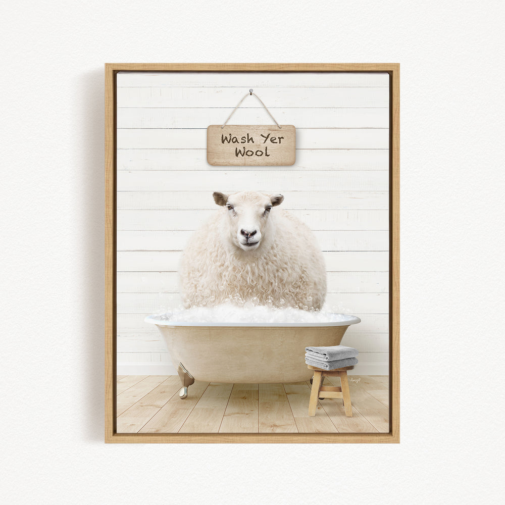 A fluffy white sheep is sitting in a bathtub filled with water, with a sign above it that says "Wash Yer Wool".