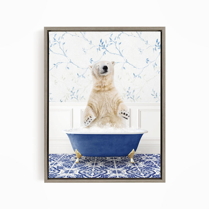 A polar bear sitting in a blue bathtub filled with bubbles, surrounded by a blue and white patterned rug.