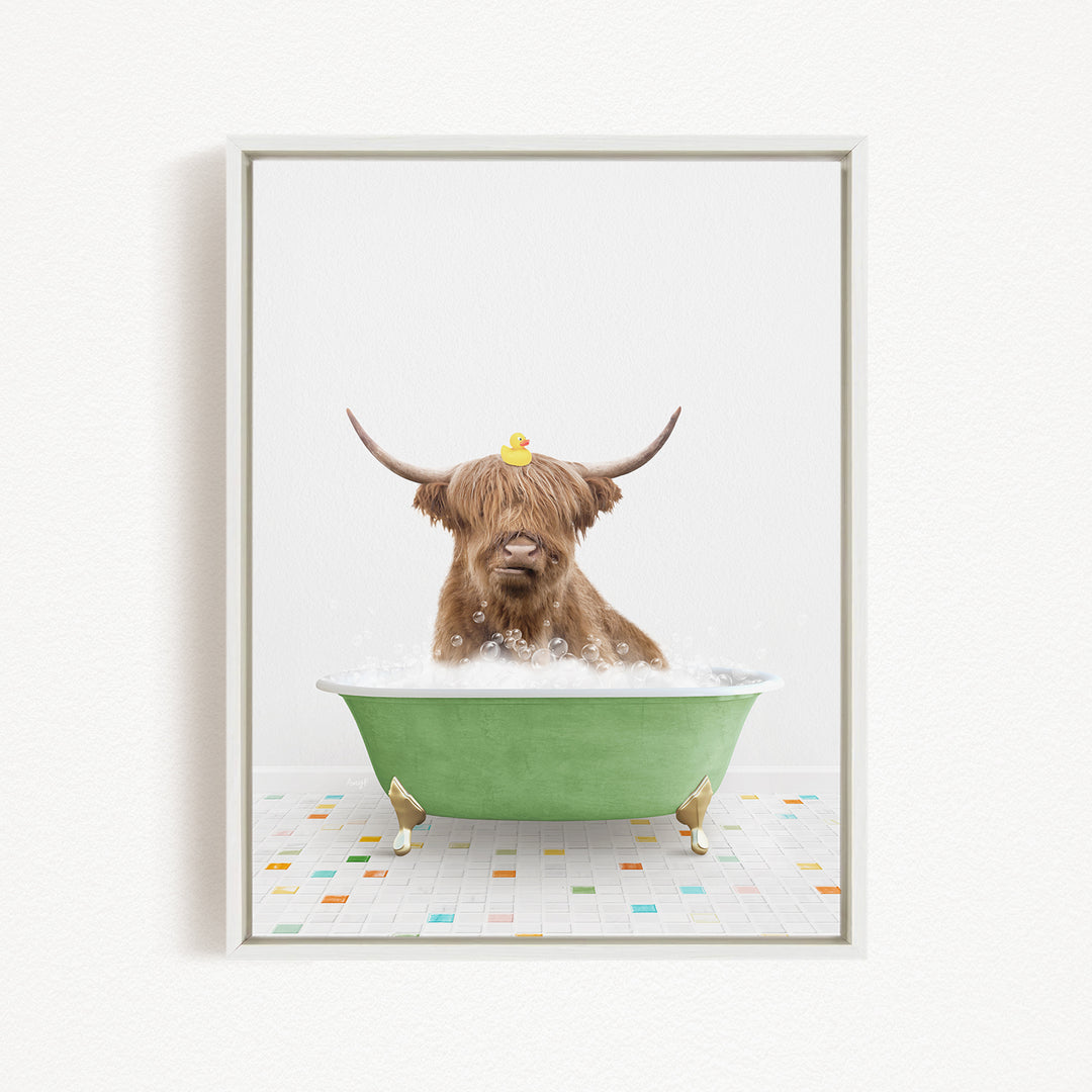 A Highland cow with large horns is sitting in a green bathtub filled with bubbles, with a yellow rubber duck perched on its head.