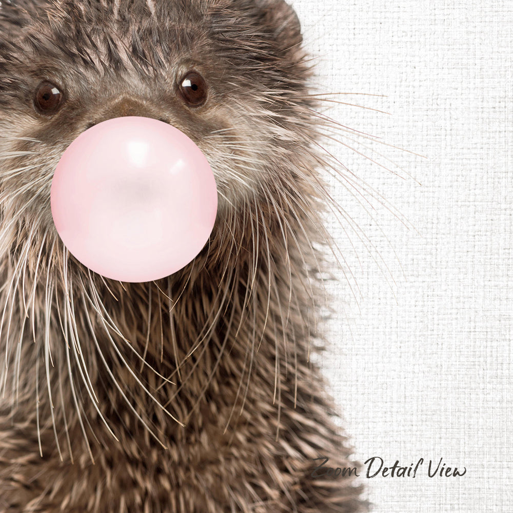 A close-up of an otter blowing a bubble with a pink bubble gum bubble.