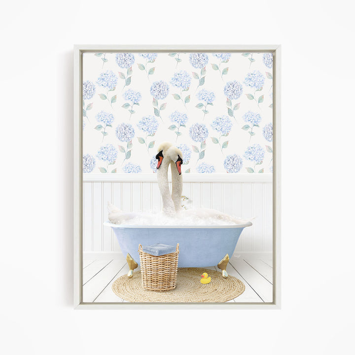 A pair of swans sitting in a blue bathtub, surrounded by a floral patterned wall and a basket of rubber ducks.
