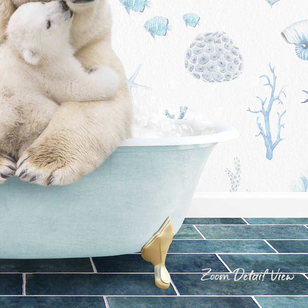 A polar bear is sitting in a bathtub, with another polar bear cuddling with it. The bathtub is placed on a blue tiled floor, and there is a wall with a marine-themed wallpaper behind the bears.
