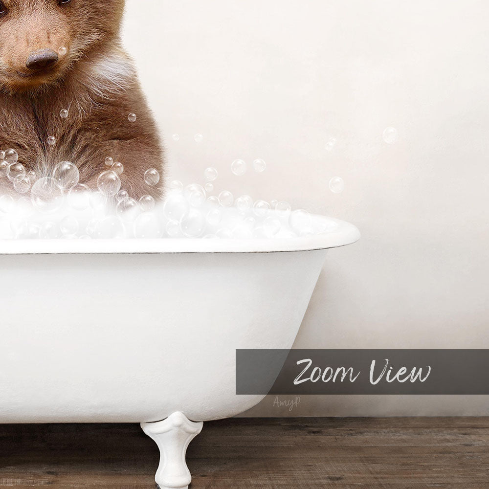 A brown bear sitting in a white bathtub filled with bubbles, with the text "Zoom View" below the image.