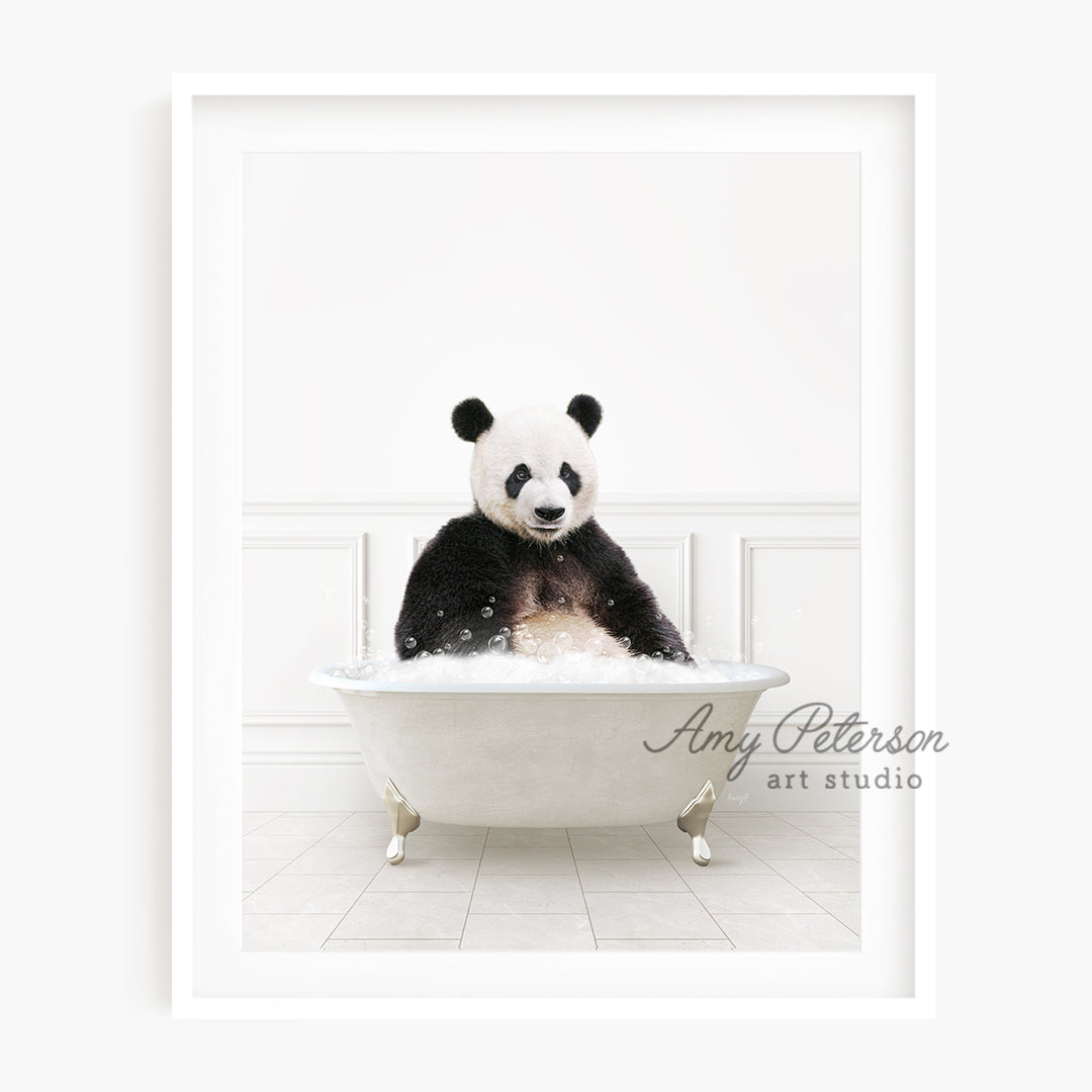 a panda bear sitting in a bath tub