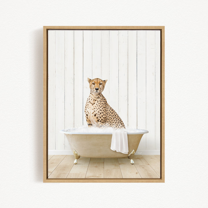A cheetah sitting in a bathtub filled with water, with a towel draped over the side of the tub.