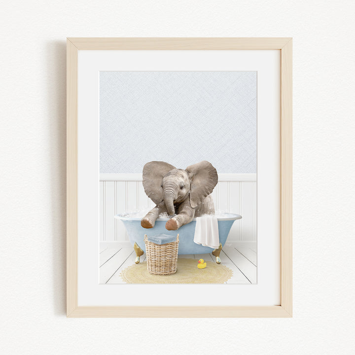 A baby elephant sitting in a blue bathtub, surrounded by yellow rubber ducks.