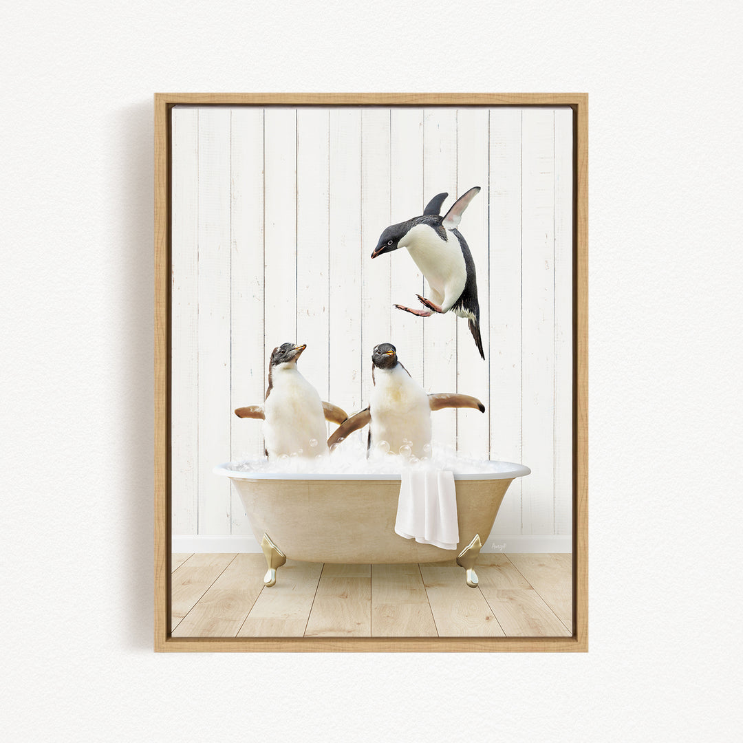 A framed image depicting three penguins sitting in a bathtub, with one penguin flying towards the others.