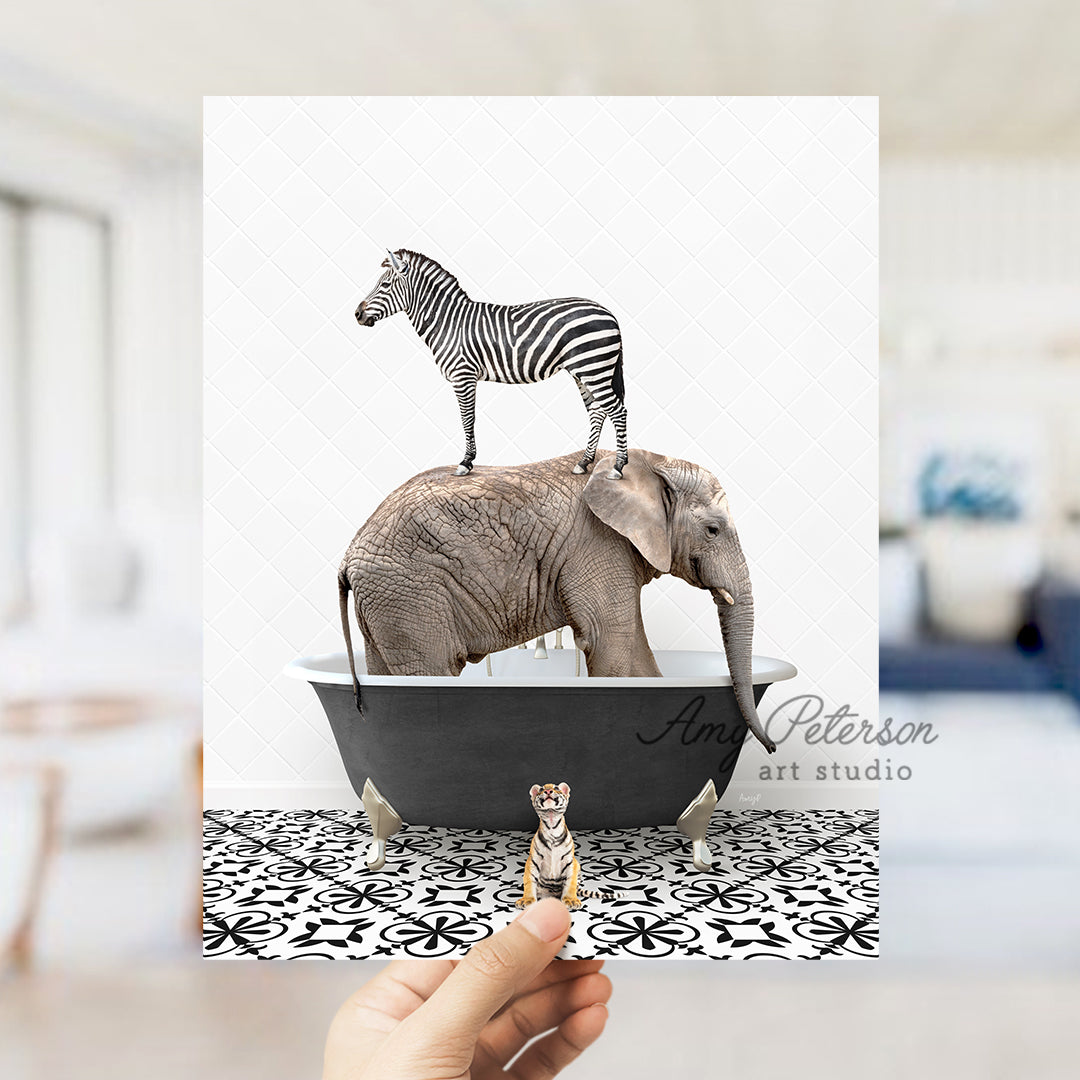 a person holding up a card with a picture of a zebra and an elephant in