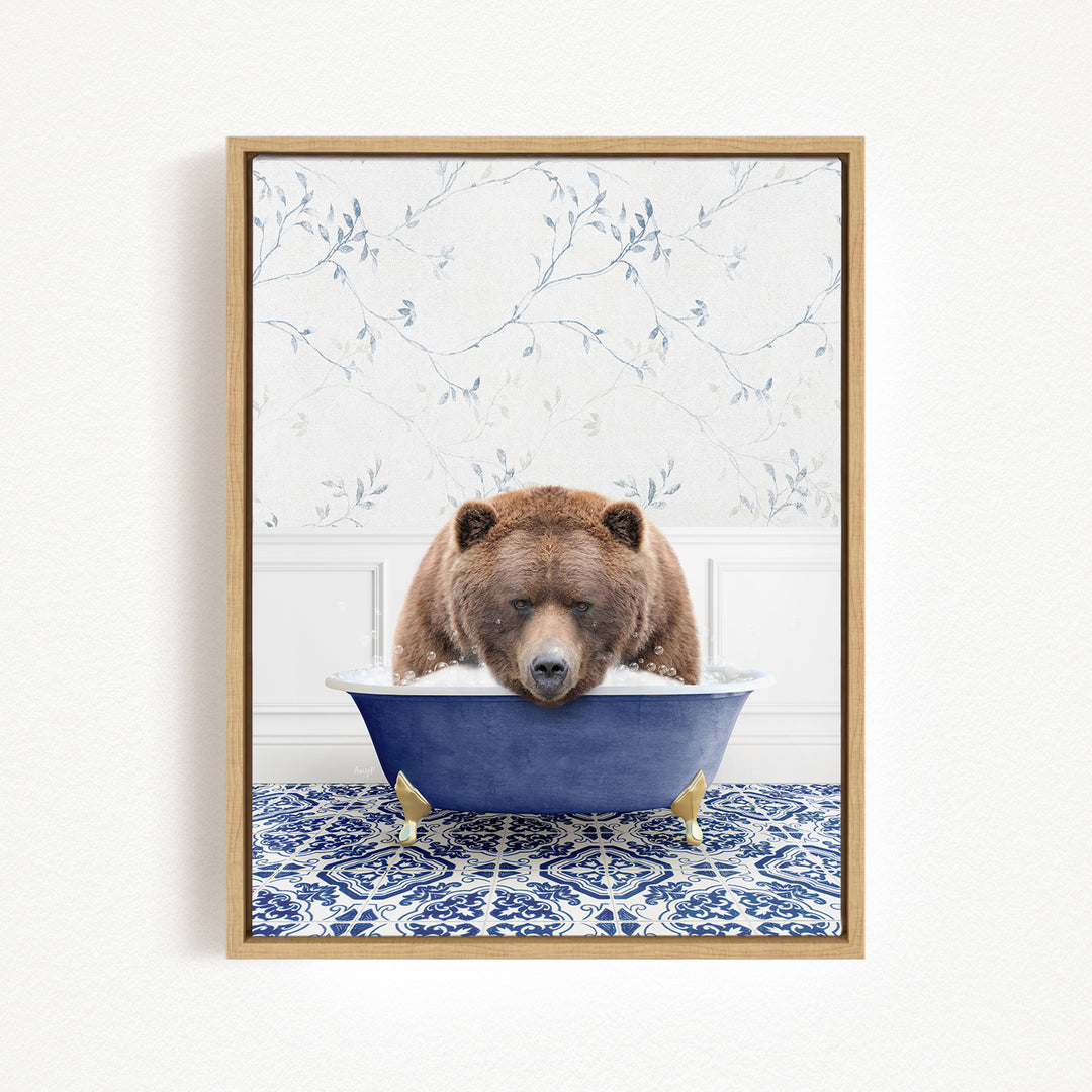 A brown bear is sitting in a blue bathtub, appearing to be enjoying a relaxing bath.