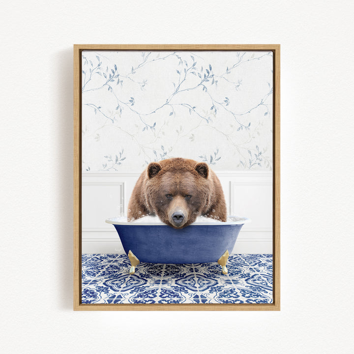 A brown bear is sitting in a blue bathtub, appearing to be enjoying a relaxing bath.