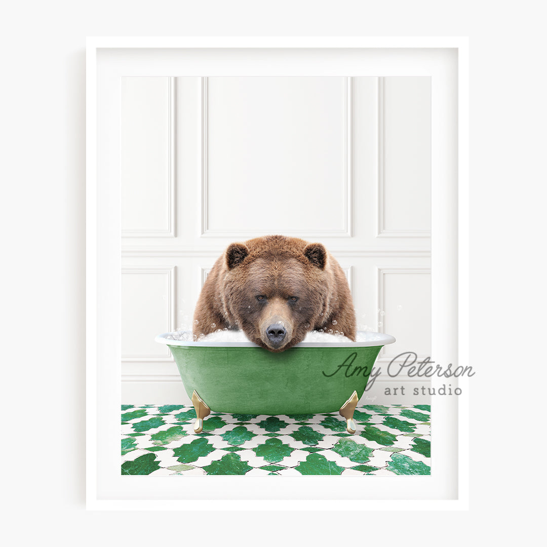 a brown bear sitting in a green bowl