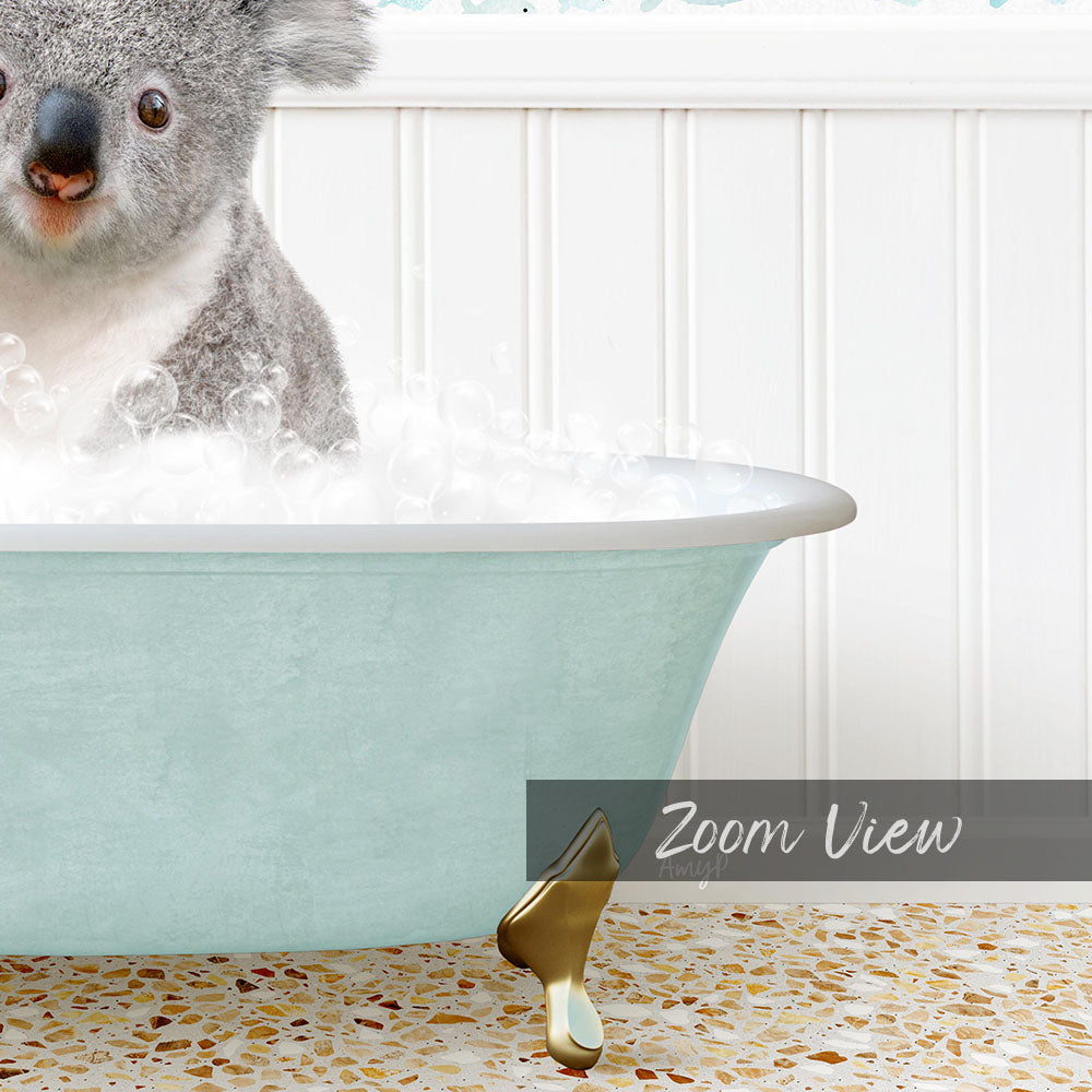 A koala sitting in a light blue bathtub filled with bubbles, with a text overlay that reads "Zoom View".