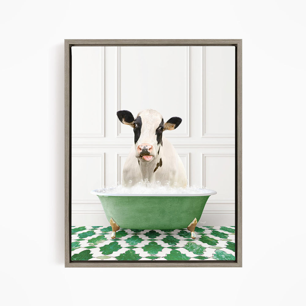 A black and white cow is sitting in a green bathtub filled with water, creating a whimsical and humorous scene.