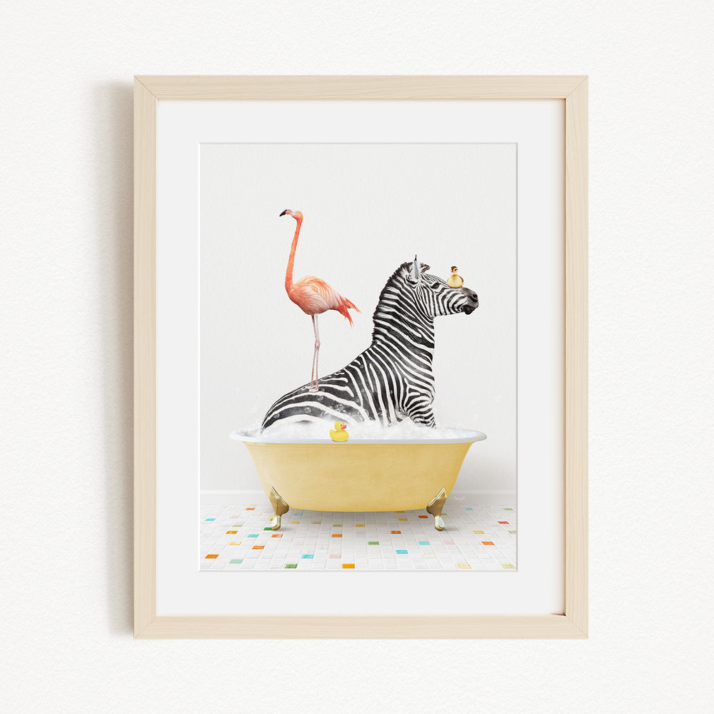 A framed image depicting a zebra sitting in a yellow bathtub, with a flamingo standing on its back and a bird perched on its head.