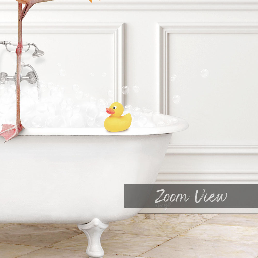 A yellow rubber duck sits in a white bathtub filled with bubbles, with a pink object hanging from the faucet.