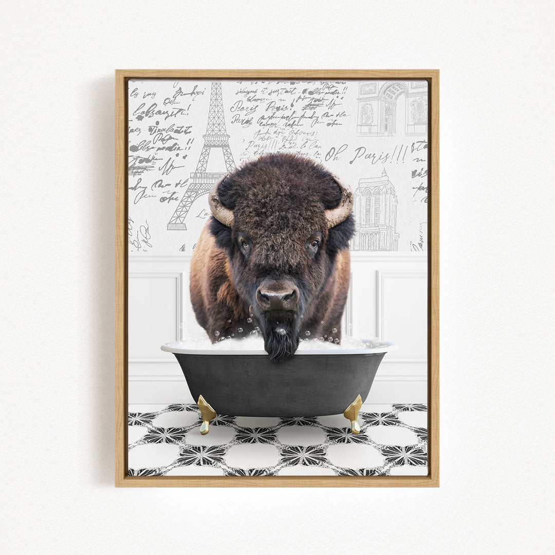 A buffalo with large horns is standing in a bathtub, with a Paris-themed background behind it.