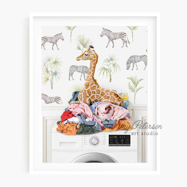 a giraffe sitting on top of a washing machine