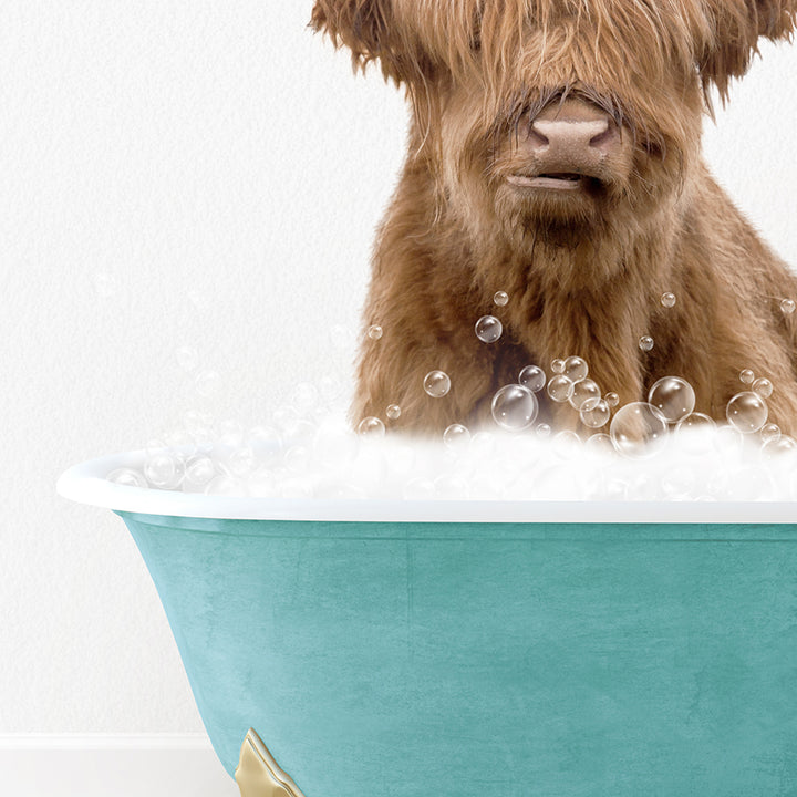 a brown dog sitting in a bath tub filled with bubbles