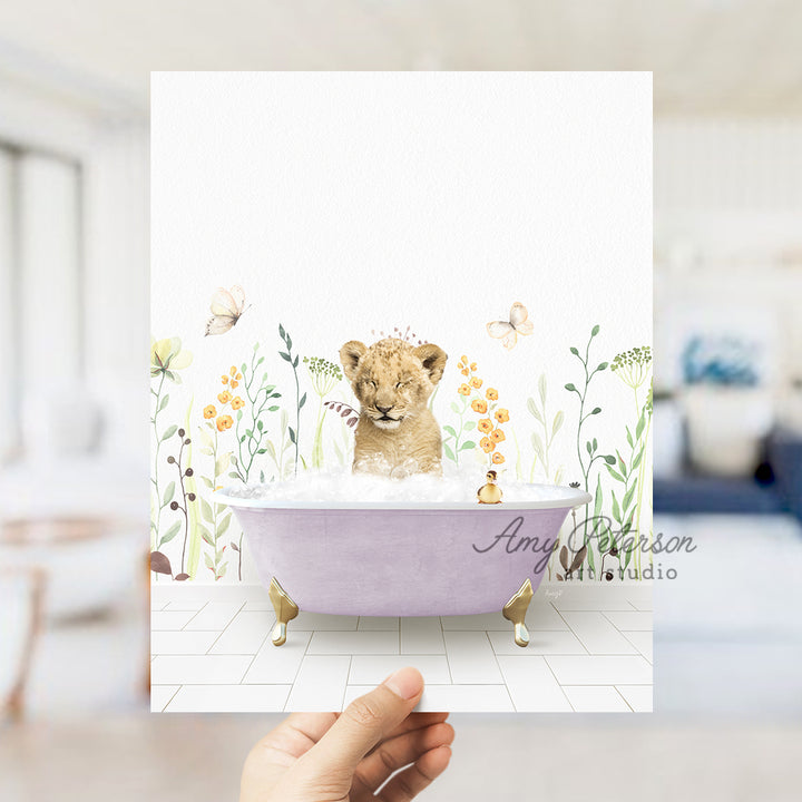 a hand holding up a card with a picture of a lion in a bathtub