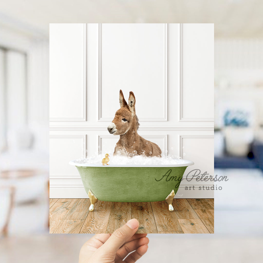 a hand holding a card with a dog in a bathtub